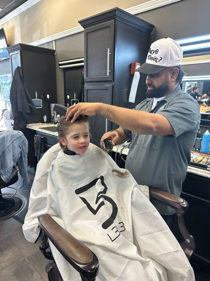 Vik, barber at Millbrae Barbershop