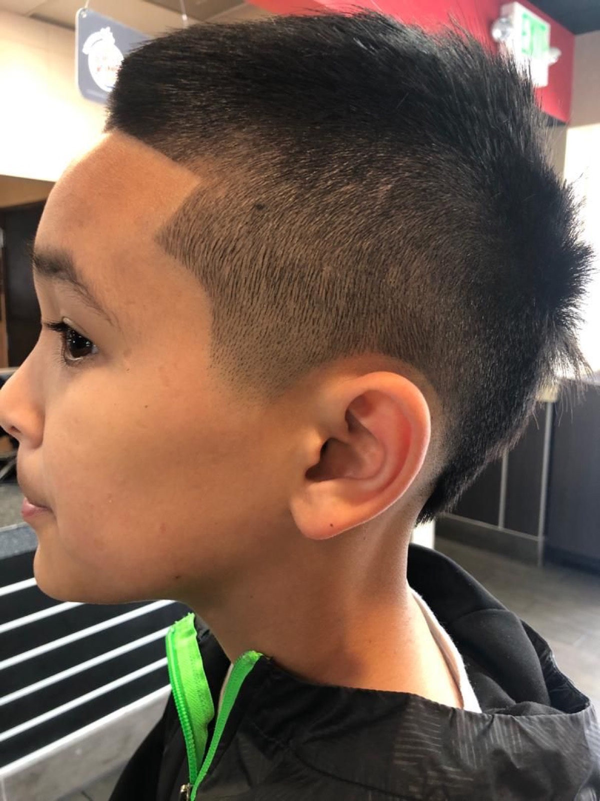 Kids mohawk with a hard line and a skin fade at the sides